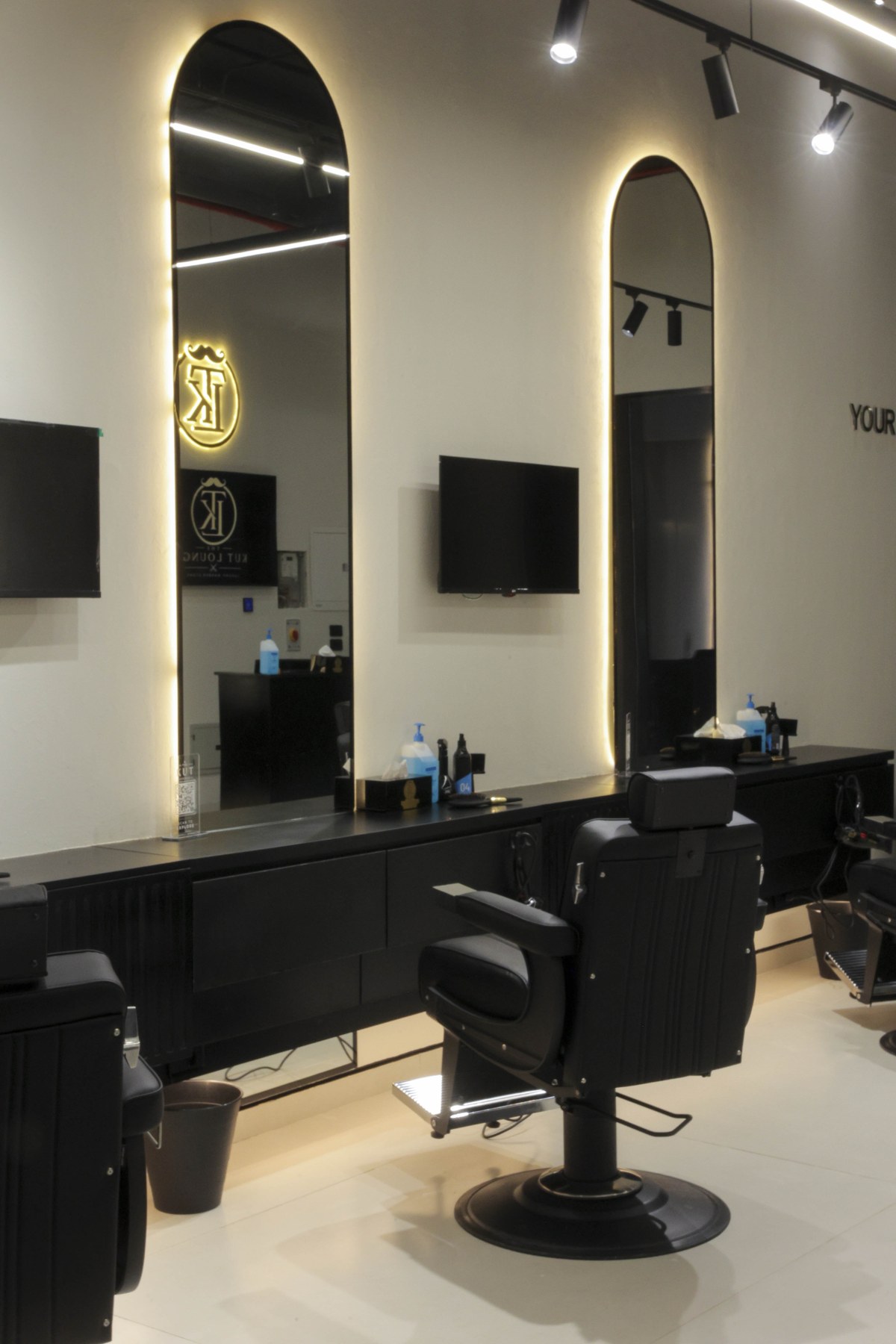 Barber station with the illuminated Kut Lounge monogram